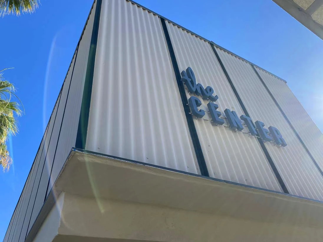 A midcentury modern style commercial building with lettering that reads 'The Center'